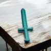 Blue toy sword on wooden table